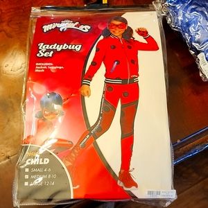Girls Miraculous Lady bug costume includes wig.